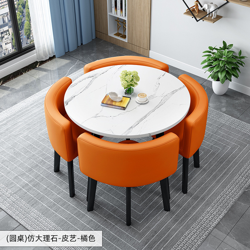 Tavolo rotondo decorato + sedia in pelle arancione