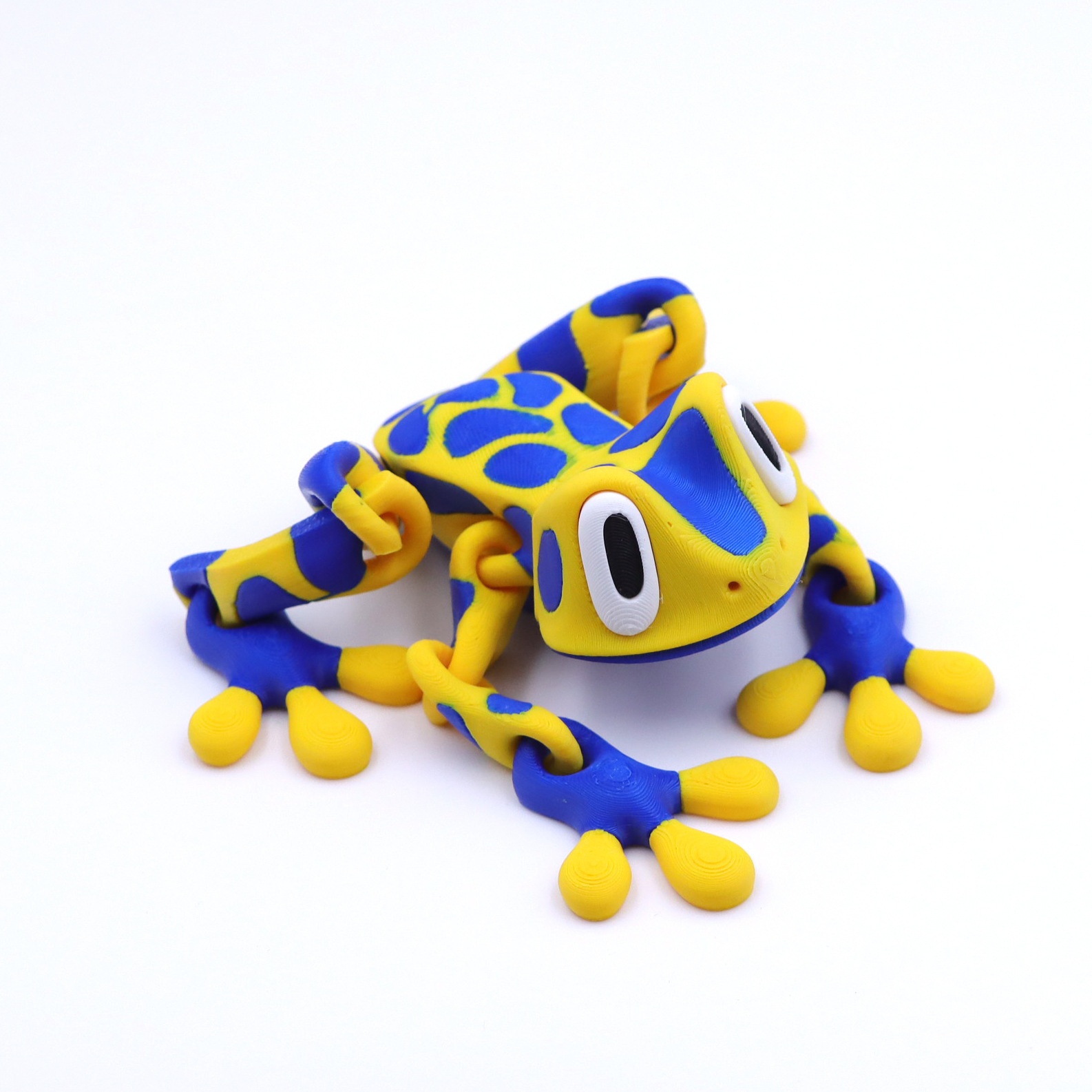 Grenouille magnétique de 21 cm, jaune et bleu tachetée.