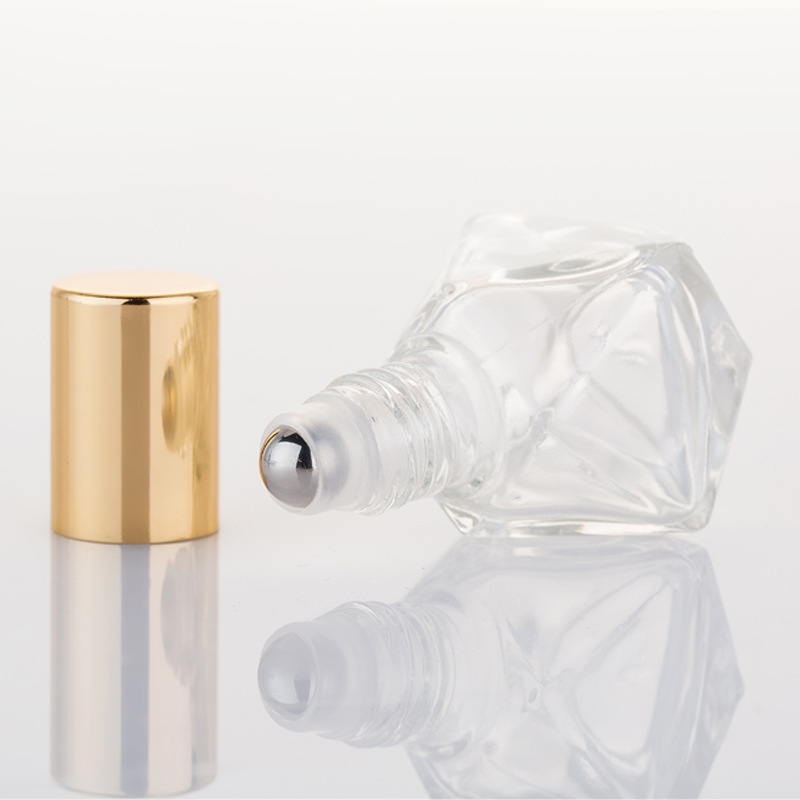 clear bottle with gold lid