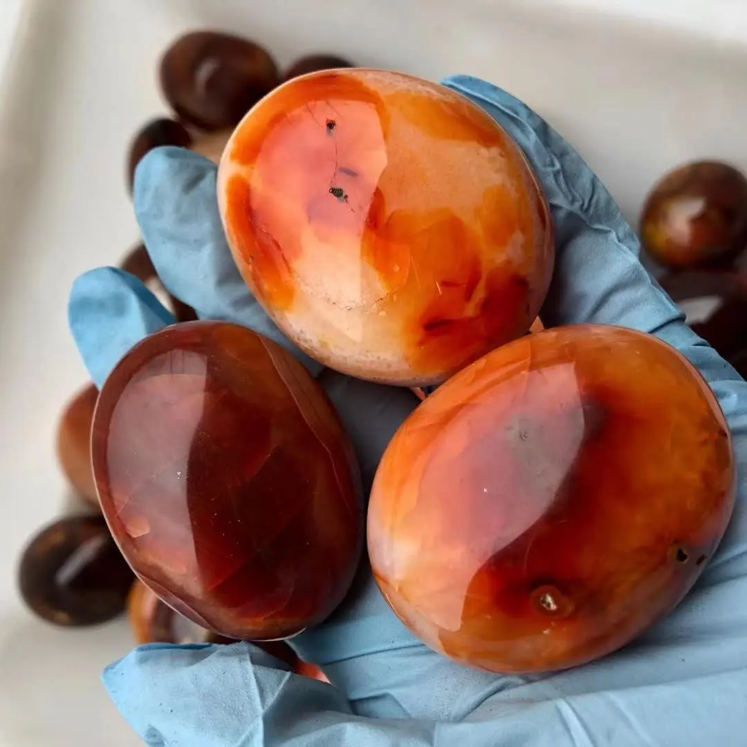 Venta al por mayor naturales ágata rojo Palma piedra pulido de piedra de cristal de cuarzo cornalina cayó piedra para venta