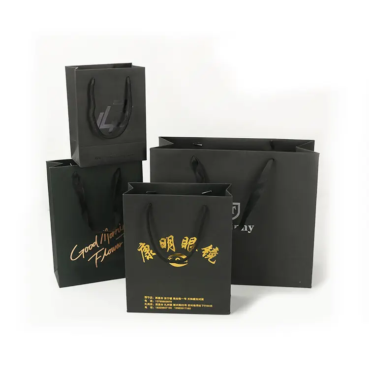 Toptan özel baskılı siyah lüks alışveriş hediye kağıt saplı çanta ile kendi logo şerit kolu