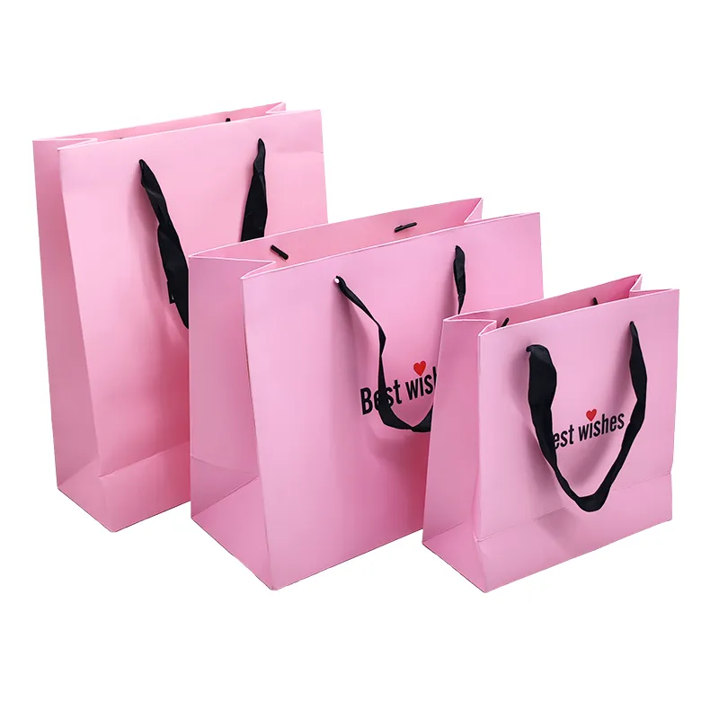 हॉट स्टैम्पिंग शॉपिंग बुटीक पेपरबैग मिनी कपड़े क्रिसमस पार्टी गुलाबी सफेद लक्जरी उपहार कस्टम पेपर बैग रिबन हैंडल के साथ