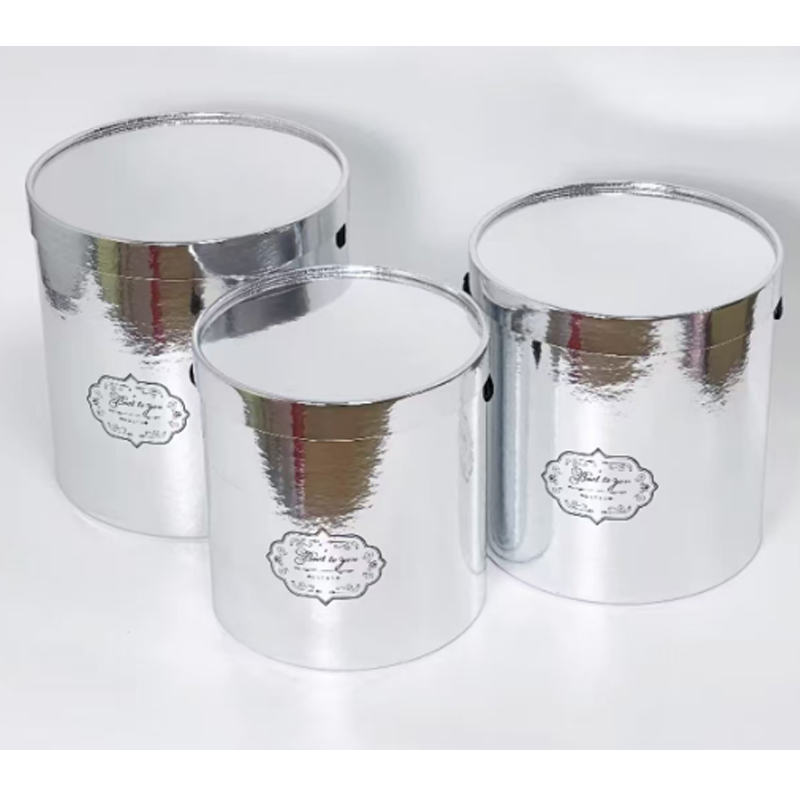 Three silver covered cases (one large, one medium and one small)