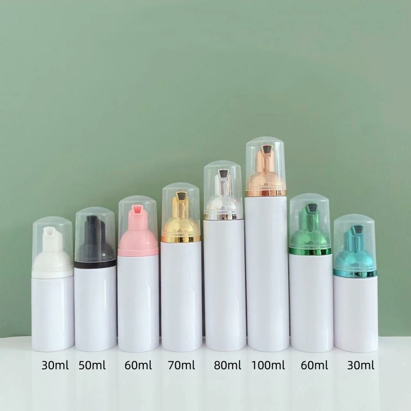 ขวดสีขาวพร้อมหัวปั๊มไฟฟ้าและฝาใส