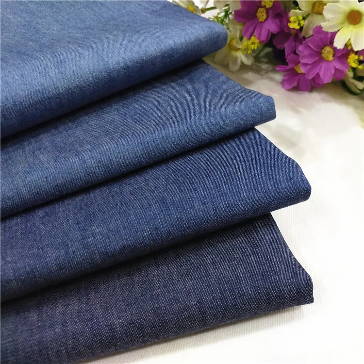 Diskon Besar-besaran 100% Benang Kepar Denim Celup Tenun Rayon Kain Pakaian Denim Lembut Celup untuk Jin