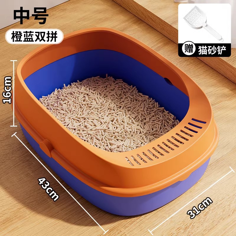 Pala para arena de gato, mediana, en tonos naranja y azul.