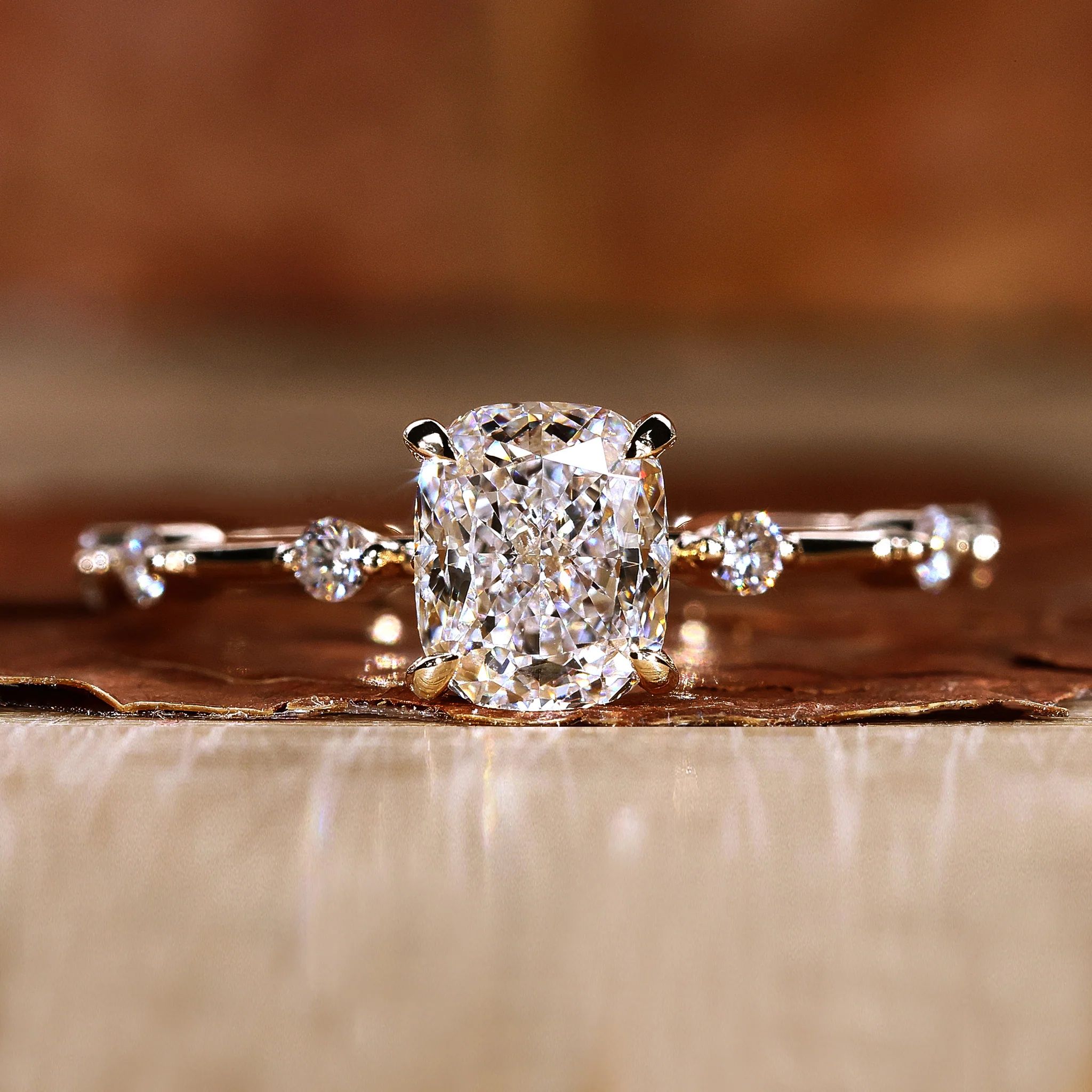 cushion side-stone ring