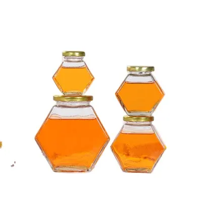 Vendita calda 250g 350ml forma esagonale campione gratuito barattolo di miele in vetro vuoto personalizzato con mestolo e coperchi in legno