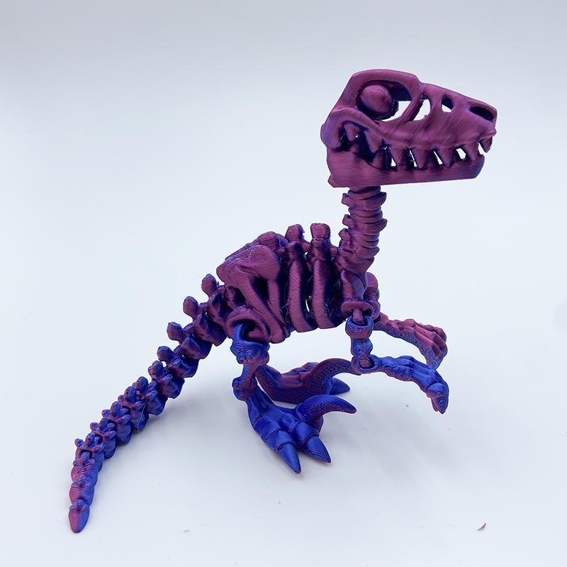 มังกรแร็พเตอร์ยาว14ซม. สีแดงและสีน้ำเงิน