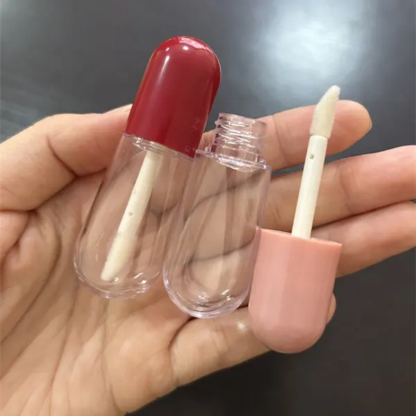 Offre Spéciale mini tubes de brillant à lèvres en forme de pilule rose rouge avec logo personnalisé contenants de brillant à lèvres vides bouteille transparente avec pinceau 4ml