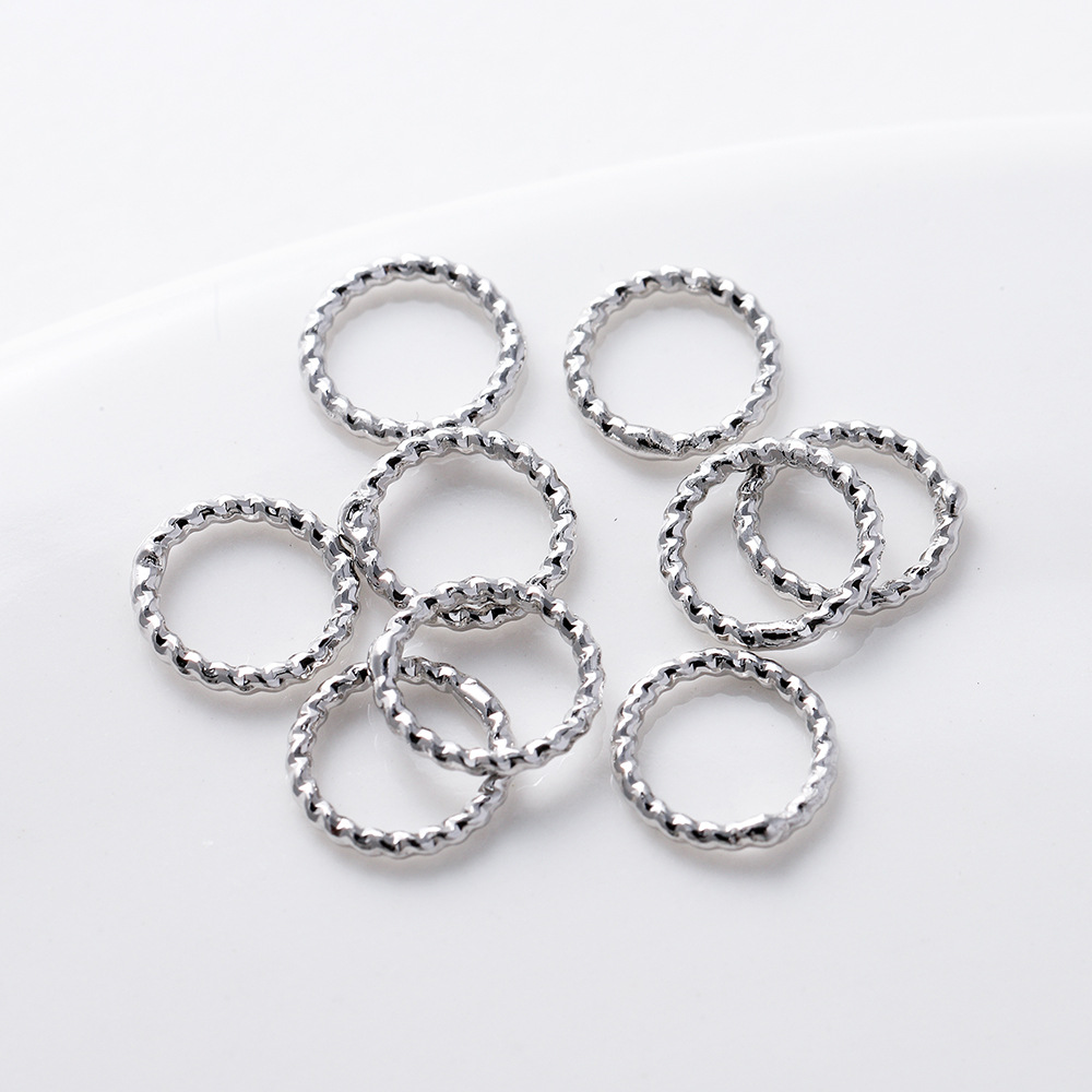 Platinum, color-preserving genuine gold closed-loop ring