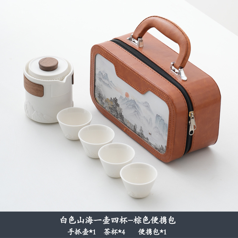 Montagne blanche, mer, un pot, quatre tasses, sac portable marron
