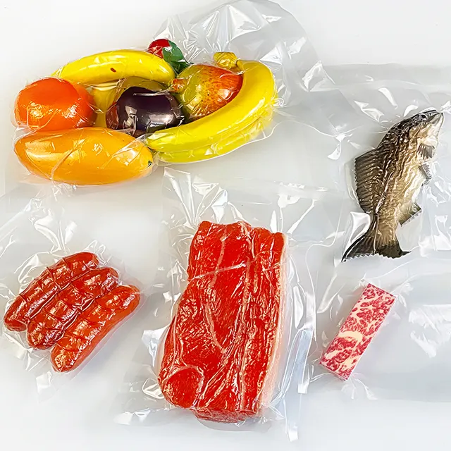 Sac sous vide ménager de taille personnalisée pour le stockage des aliments Sac en plastique en nylon pour le stockage des légumes et de la viande Sac d'emballage pour le congélateur