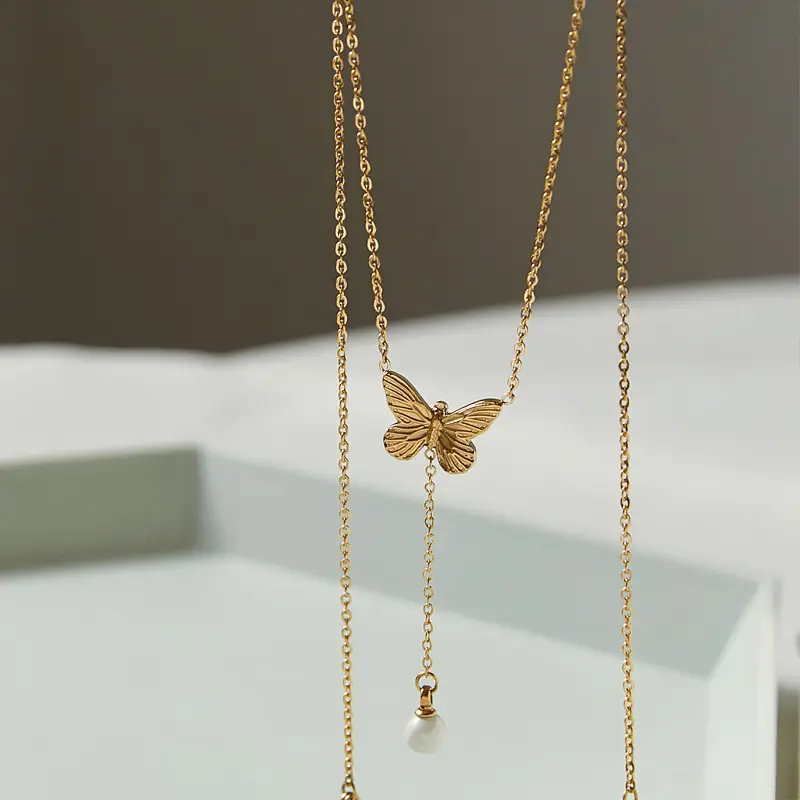 Collana alla moda girocollo senza appannamento collana di perle a farfalla in acciaio al titanio collana lunga con catena in oro nappa per donna