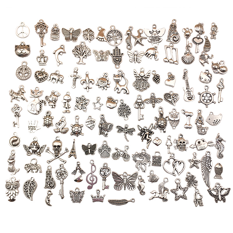 Assortiment de 100 pendentifs en argent tibétain - M210