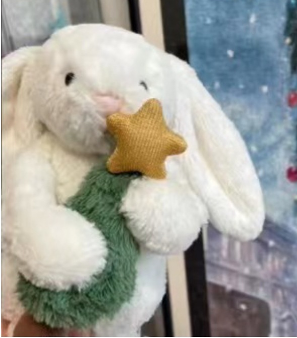 Límite navideño, Bugs Bunny sosteniendo el árbol de Navidad.