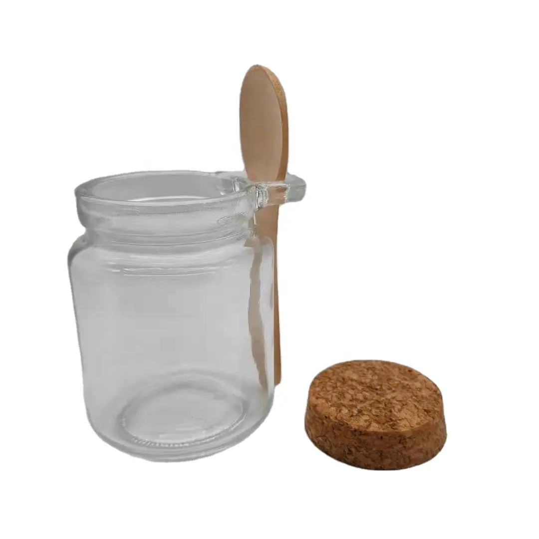 Tarro de vidrio con cuchara de madera y corcho, botella de vidrio blanco con corcho con cuchara