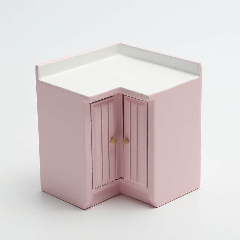 Gabinete de la esquina rosa