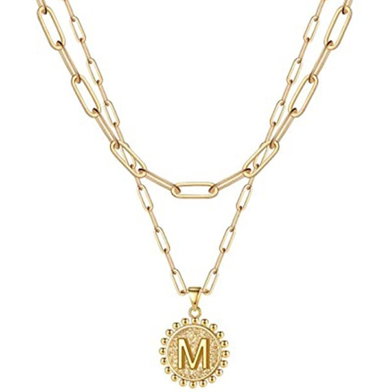 Gold letter M