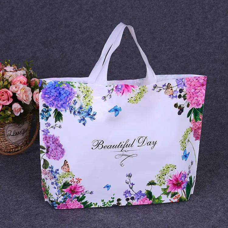 En Stock bolsas de plástico personalizada de fábrica precio respetuoso del medio ambiente de embalaje de plástico bolsa de bolsas de regalo de compras con mango