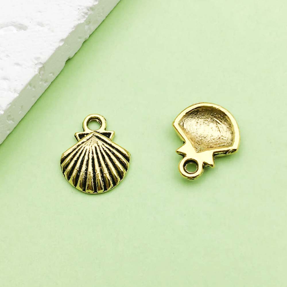 1 Coquille d'océan en or antique - 0,8 g - 13*11 mm - 11082