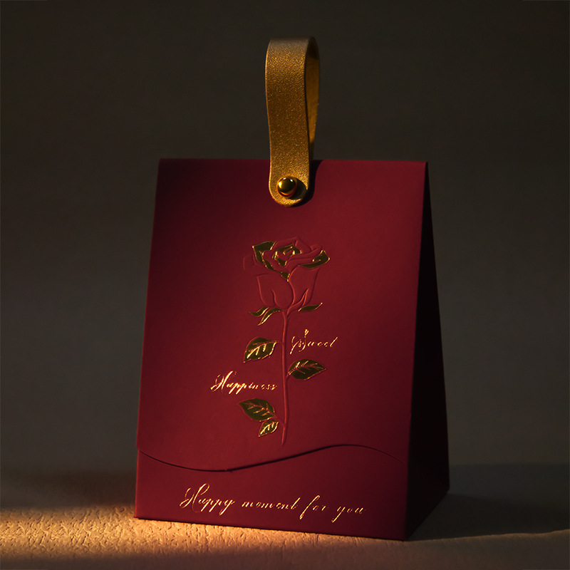 Boîte à champagne en cuir rouge vin rose.