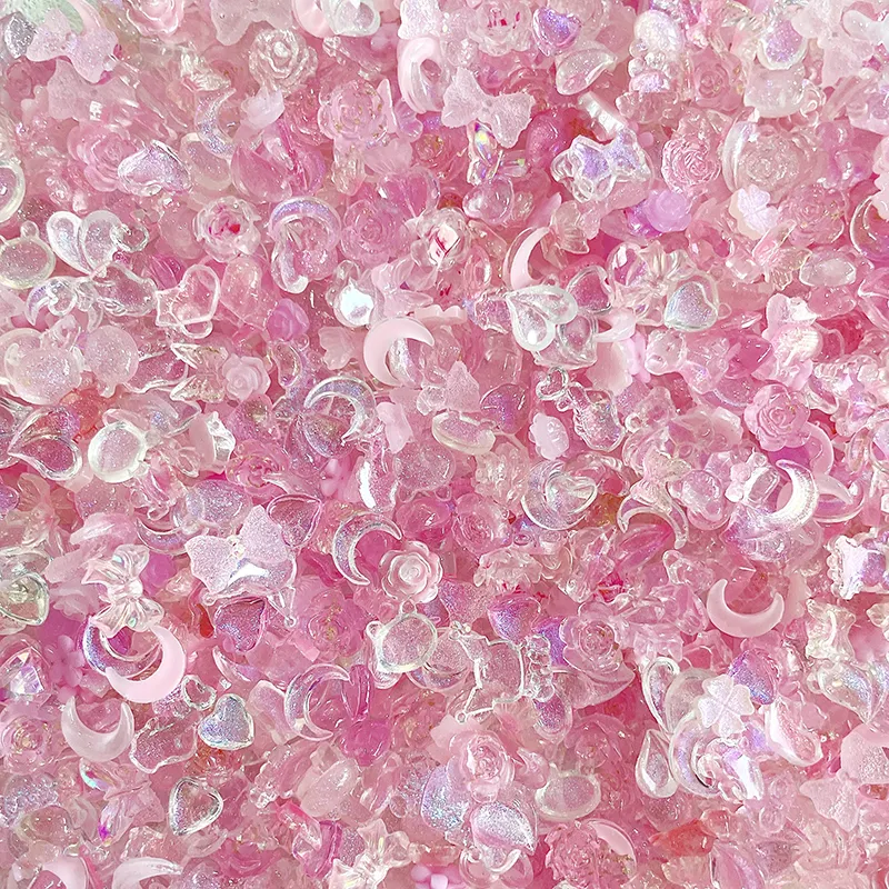 Toptan sıcak satış 50 adet/torba DIY renkli tırnak sanatı tasarım dekorasyon 3D çiçek kelebek yıldız kalp tırnak takılar