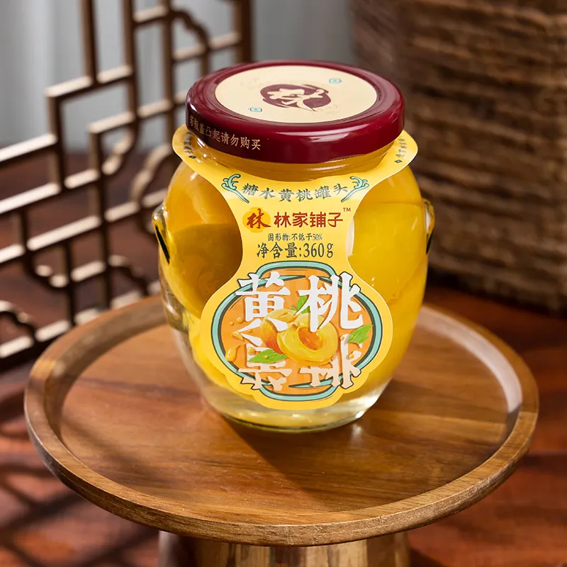 กระป๋องสีเหลืองพีชในขวดแก้วน้ำตาลน้ำ leasunfood linjiapuzi ในน้ำเชื่อมผลไม้กระป๋อง