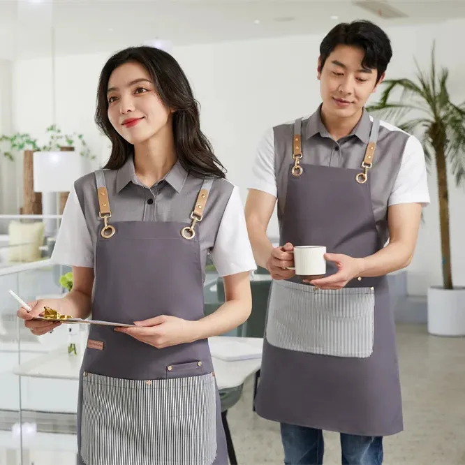 Logotipo personalizado impreso negro promoción impermeable poliéster 100% algodón orgánico cocina Chef delantales con bolsillos