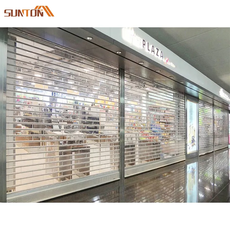 Le moderne porte avvolgibili elettriche del negozio del supermercato progettano la porta avvolgibile trasparente in policarbonato trasparente con telaio in alluminio personalizzato