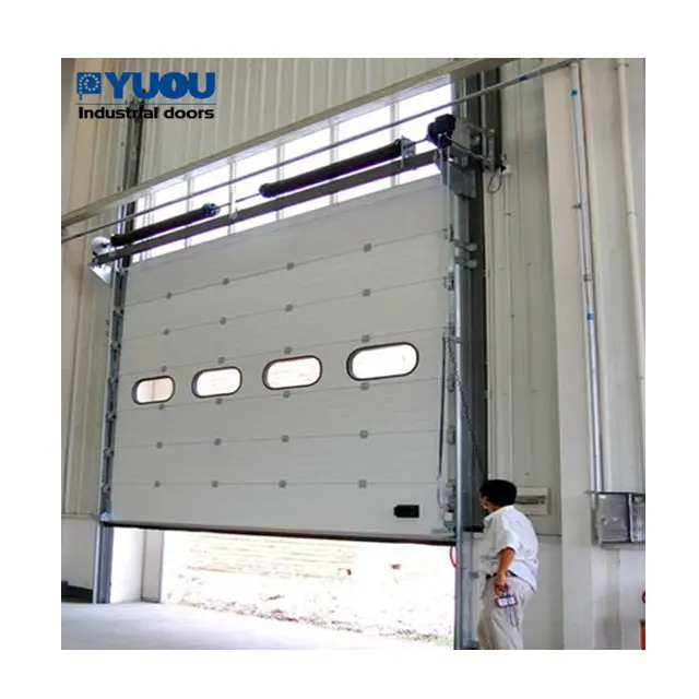 Porte de quai avec abri de quai et niveleur de quai utilisé portes de garage élévatrices industrielles automatiques sectionnelles porte pour entrepôt