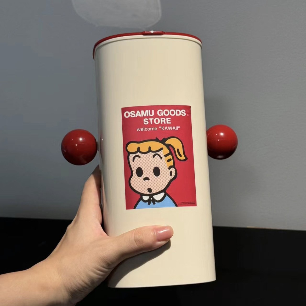 กล่องเก็บของลายการ์ตูนรูปทรงรถเข็นสีแดงและเบจ