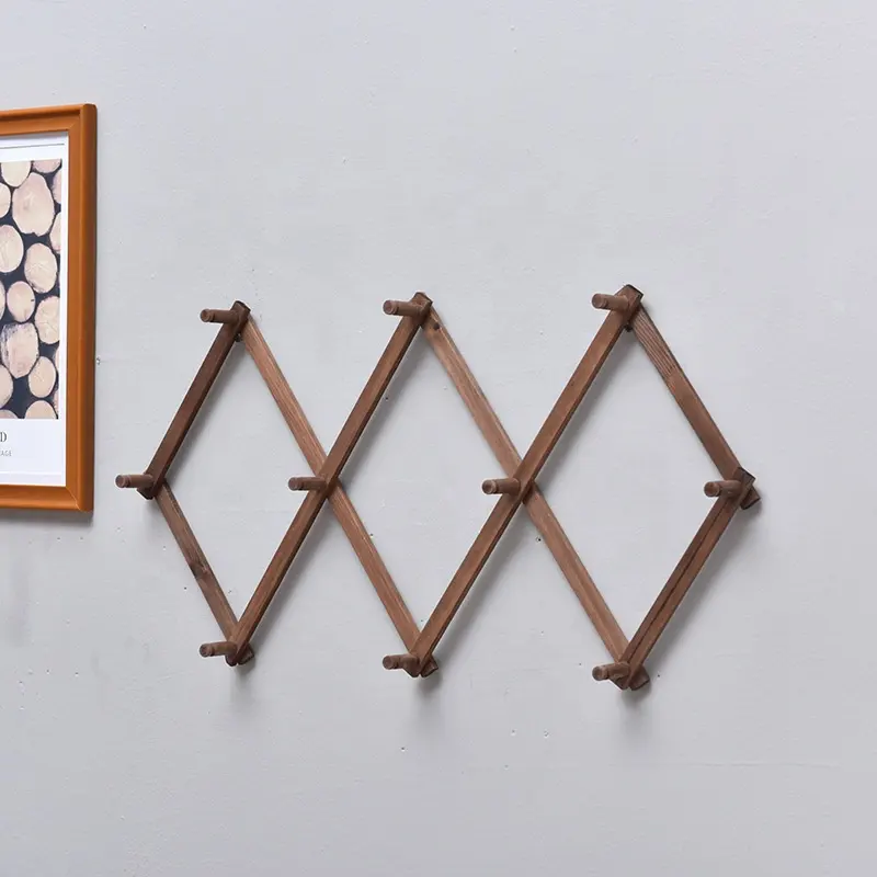 Appendiabiti pieghevole in legno stile fisarmonica con gancio a parete espandibile in soggiorno