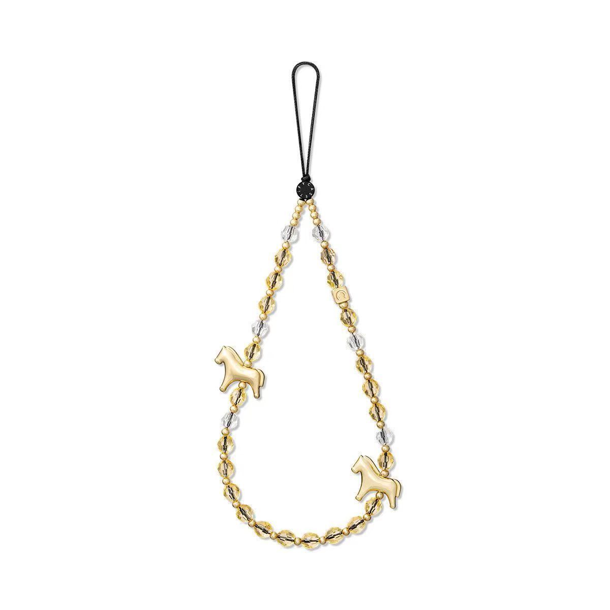 Pony de metal dorado