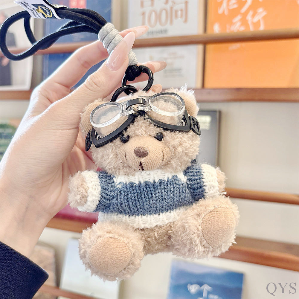 Khaki bear blue sweater lanyard glasses