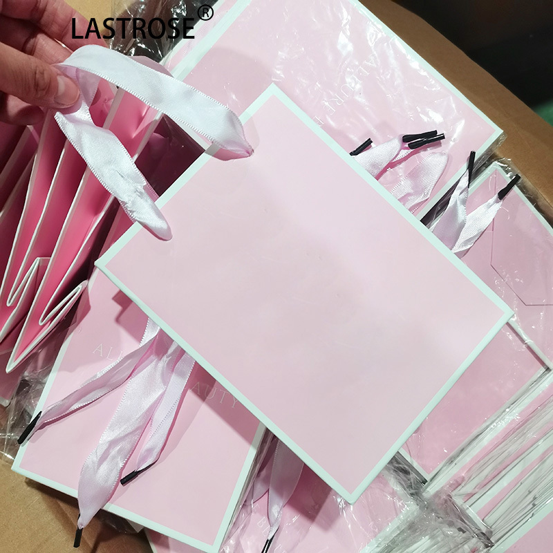 bolsa de papel rosa bebé