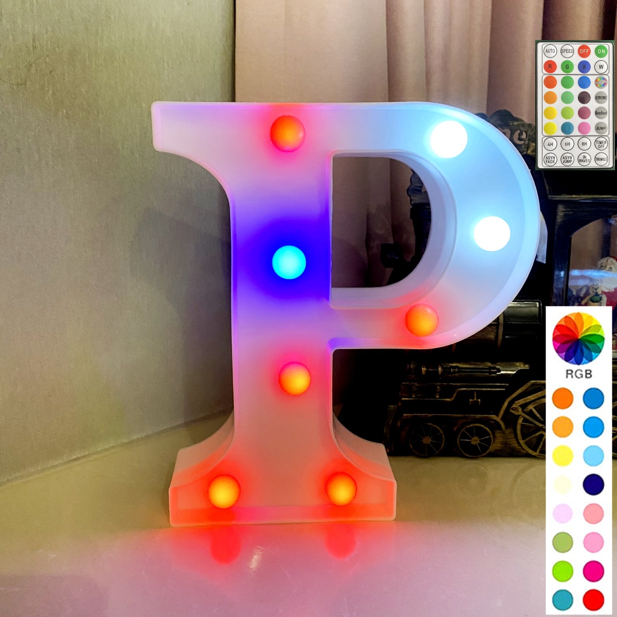 Lettre blanche de fond avec télécommande synchrone colorée : p