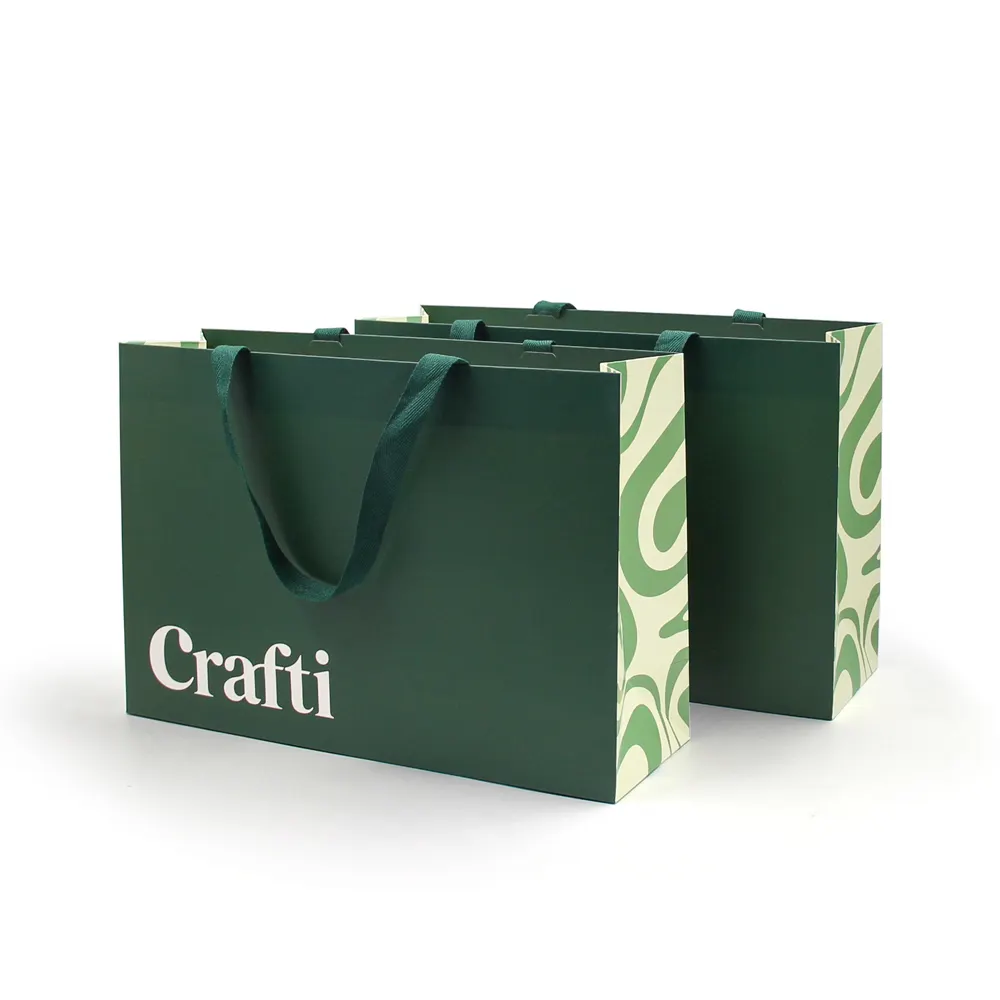 Sacchetti regalo di carta d'imballaggio del sacchetto di carta verde di lusso per l'imballaggio del sacchetto di carta su misura di buona qualità dell'abbigliamento