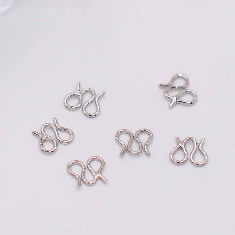 White gold M buckle