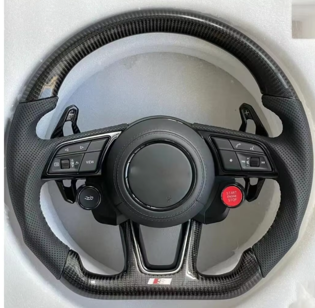 Le volant complet (fibre de carbone + cuir + pommeau)