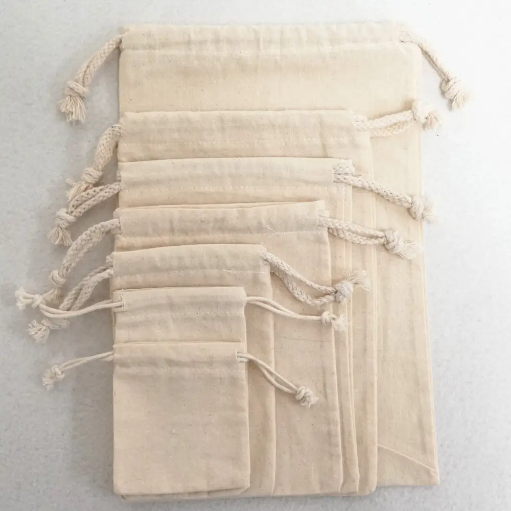 Bolsas de lona de algodón natural con logotipo personalizado, bolsas de lujo con cordón, diferentes tamaños, para polvo, en stock, regalo