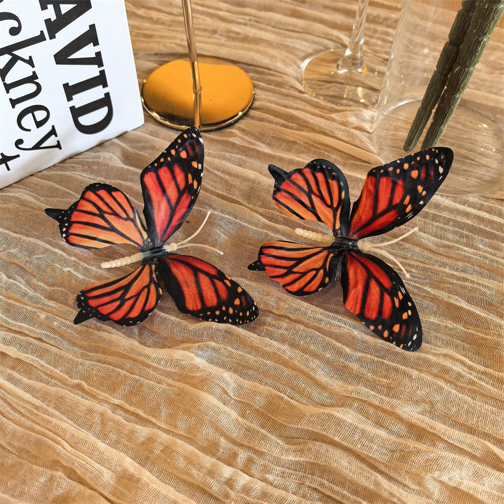 Pair of red butterfly shoe clip