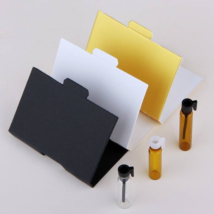 Amber glass bottle + white cap + gold paper card