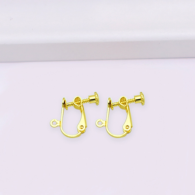 Clip para oreja con tornillo de cabeza plana, color oro KC.