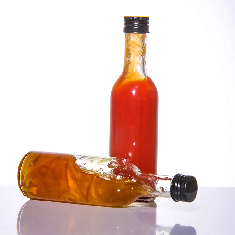 Tamaños personalizados de fábrica Venta caliente 150ml 5oz Botellas de salsa picante de vidrio para botellas de vinagre de Chile con tapa