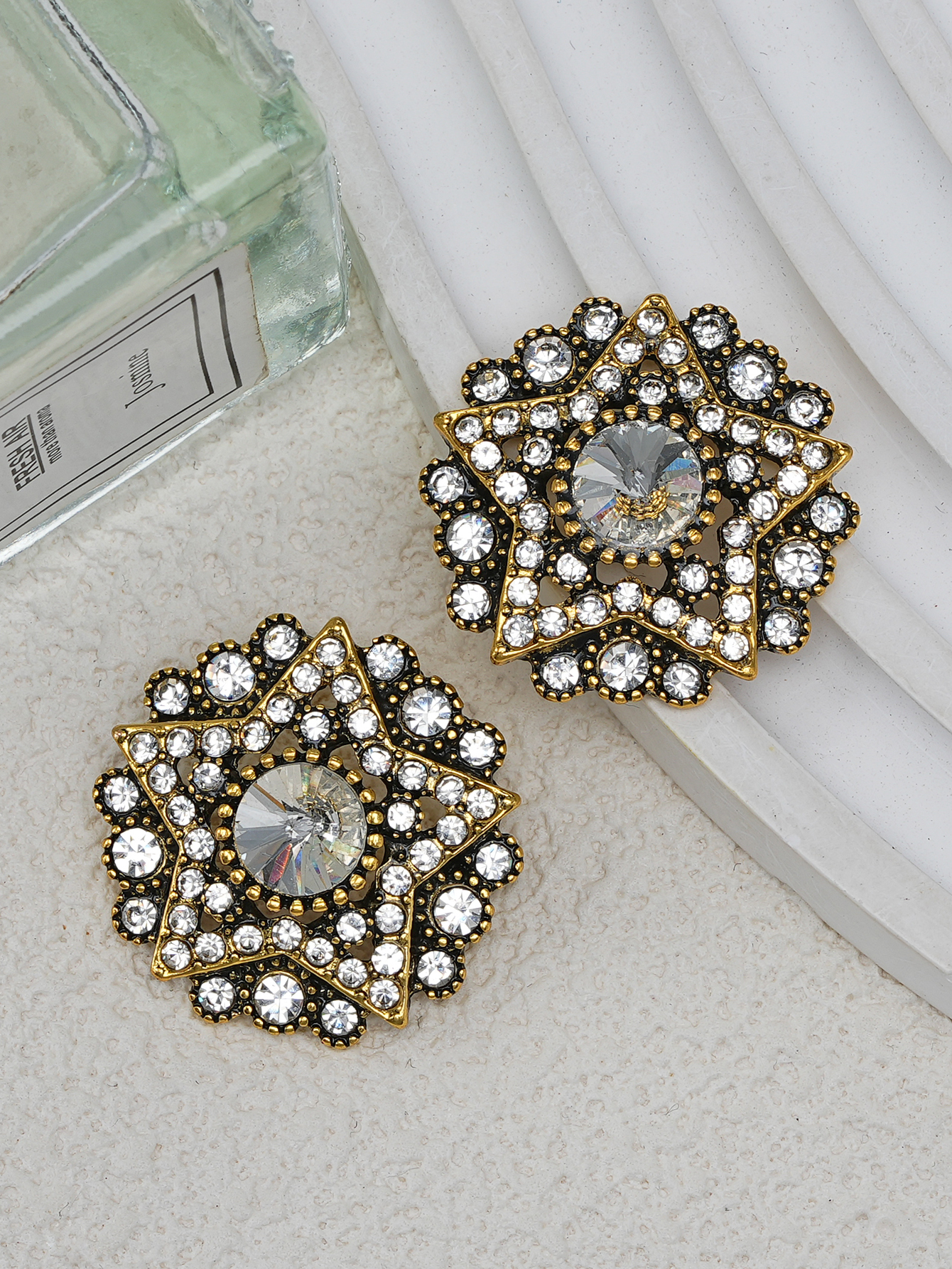 Oro 18k con strass bianchi