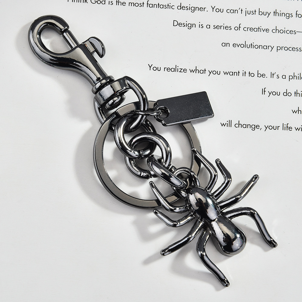 Pendentif sac araignée pistolet noir