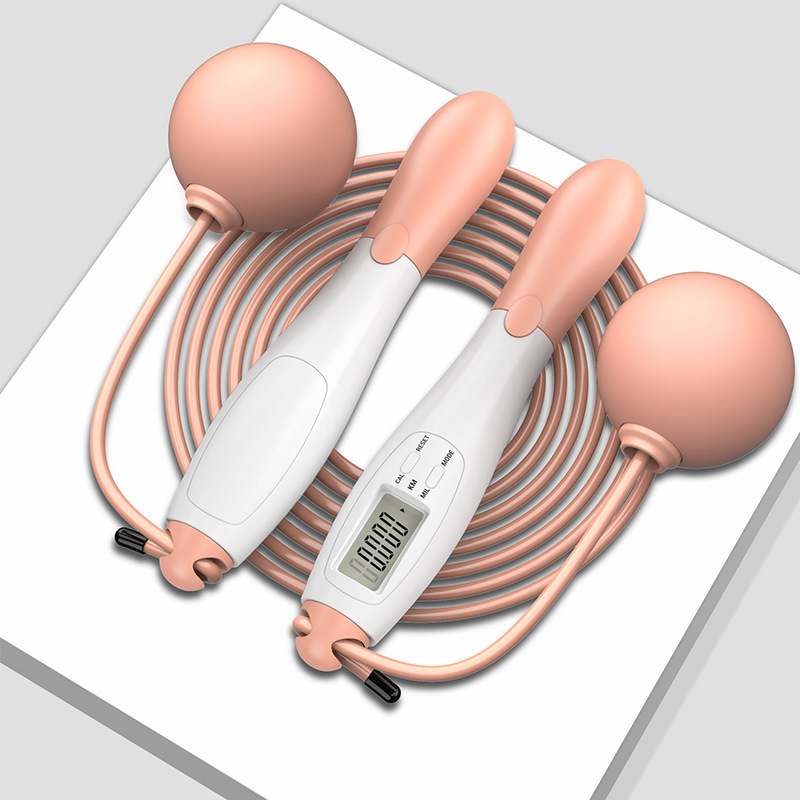 Pink and white handle, rope, small ball