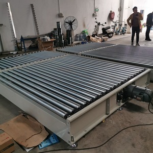 Sistema de transportador de rodillos por gravedad de acero al carbono sin potencia personalizado transportador de rodillos de carga pesada para descarga de carga de camiones
