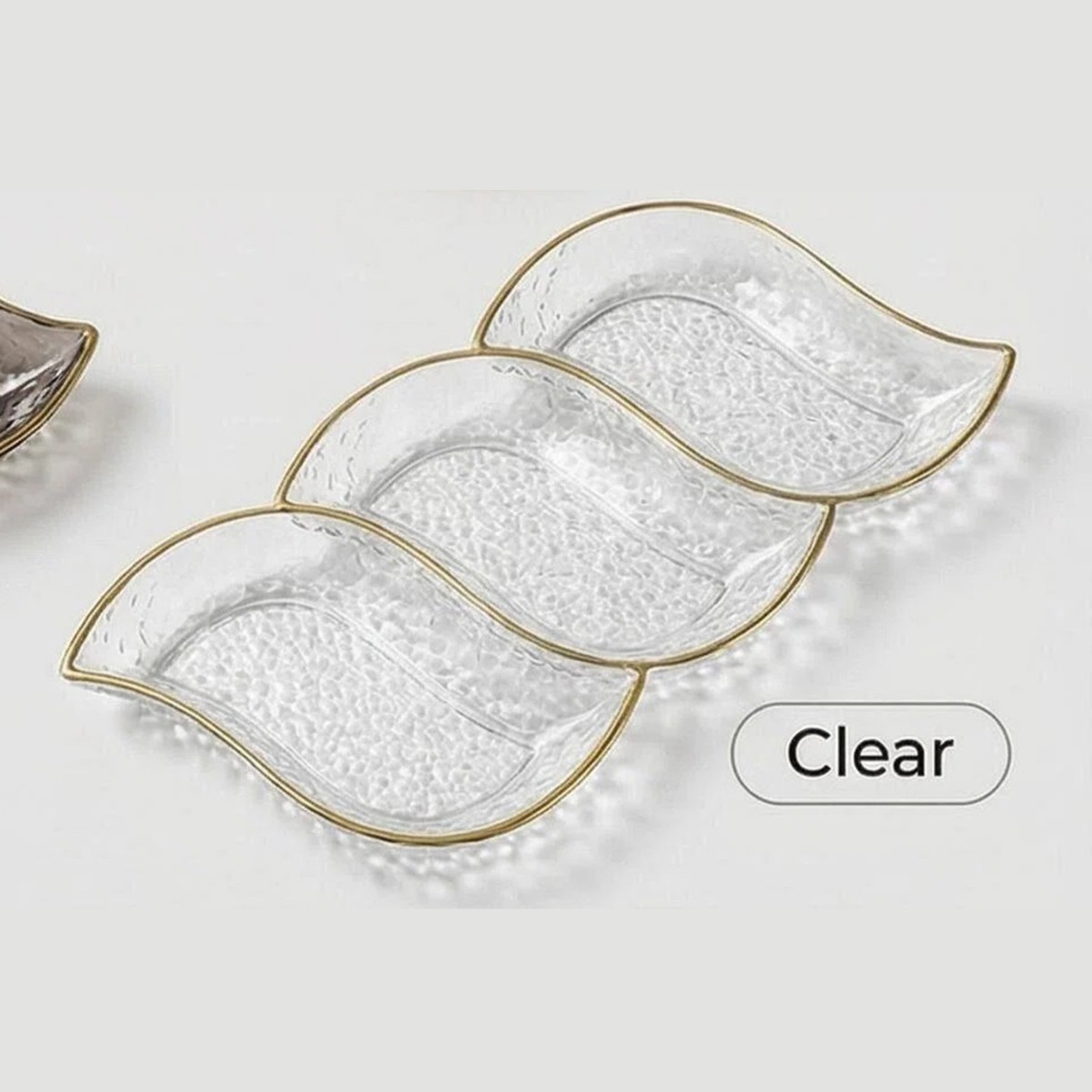 Transparent three-panel palette with wavy gold rim